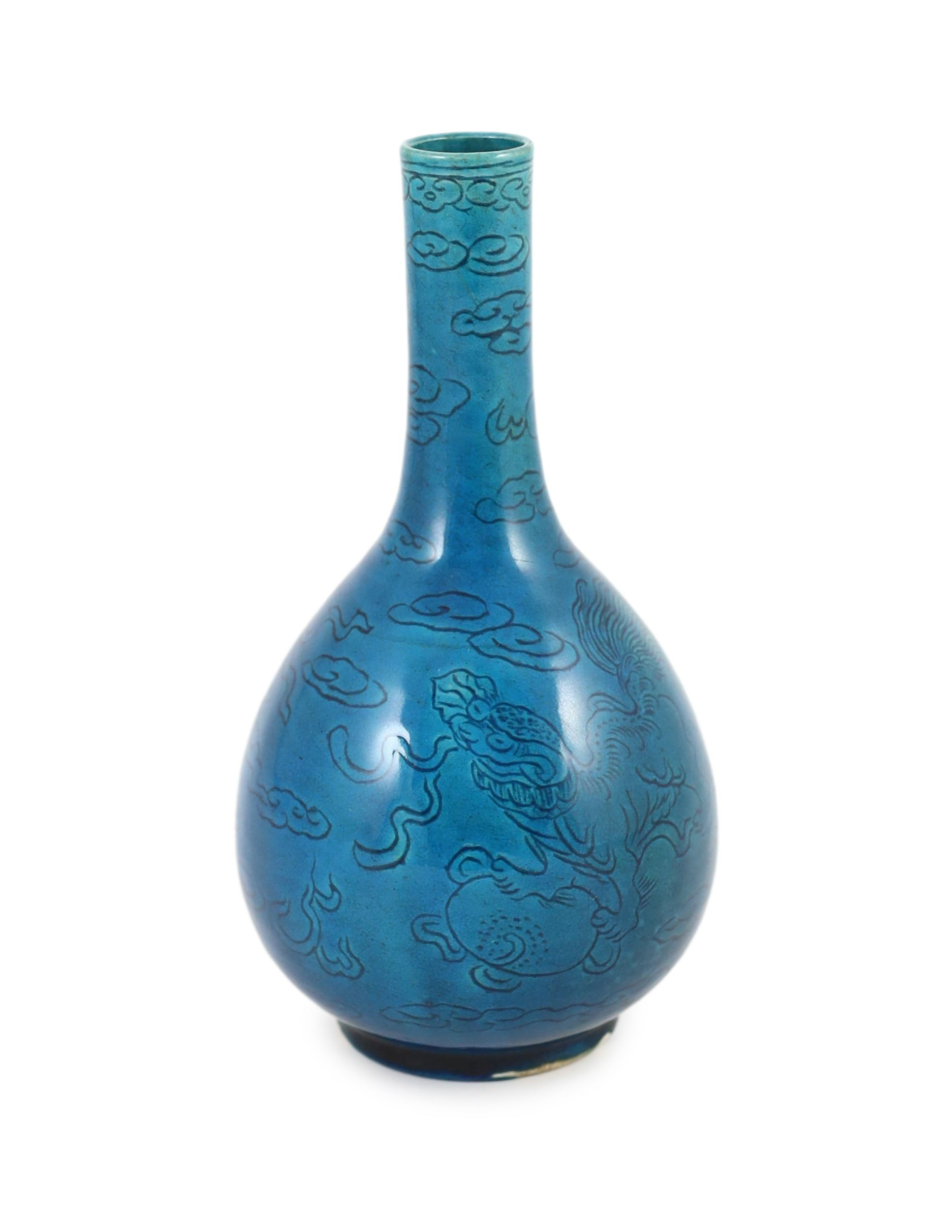 A Chinese turquoise glazed sgraffito bottle vase, 19th century, 21 cm high